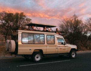 Family in Toyota Land Cruiser safari vehicle