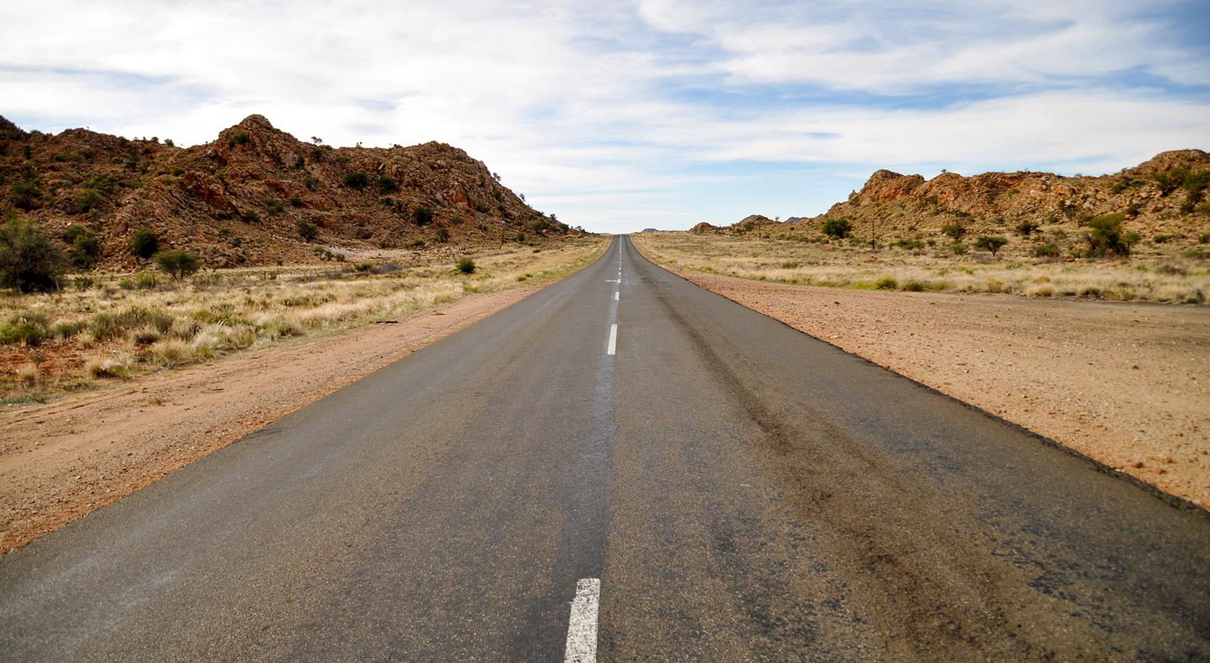 A road through the rocky and dry landscape of the Fish River Canyon.