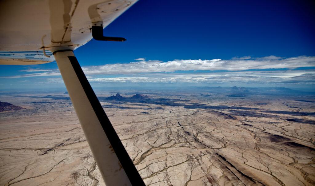A stunning aerial shot of a Namibian landscape taken during an exclusive 10-day Namibia fly-in safari with Namibia-Experience.