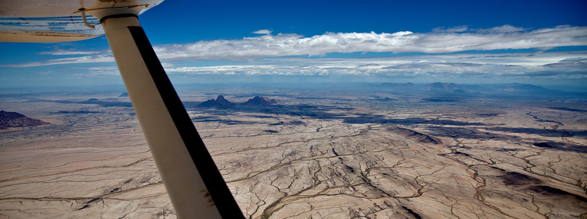 A stunning aerial shot of a Namibian landscape taken during an exclusive 10-day Namibia fly-in safari with Namibia-Experience.