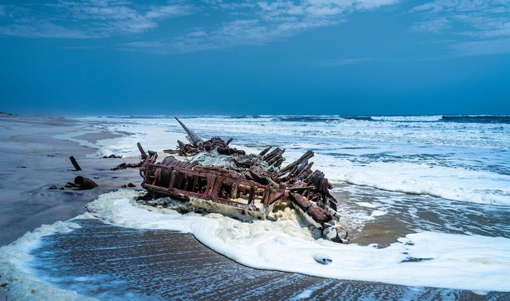 A shipwreck on the beach at the Skeleton Coast in Namibia, seen on a self-drive tour.
