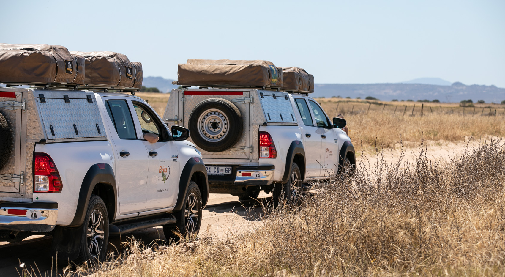 Two Namibia-Experience guided self-drive 4x4 vehicles on a dirt road in Namibia