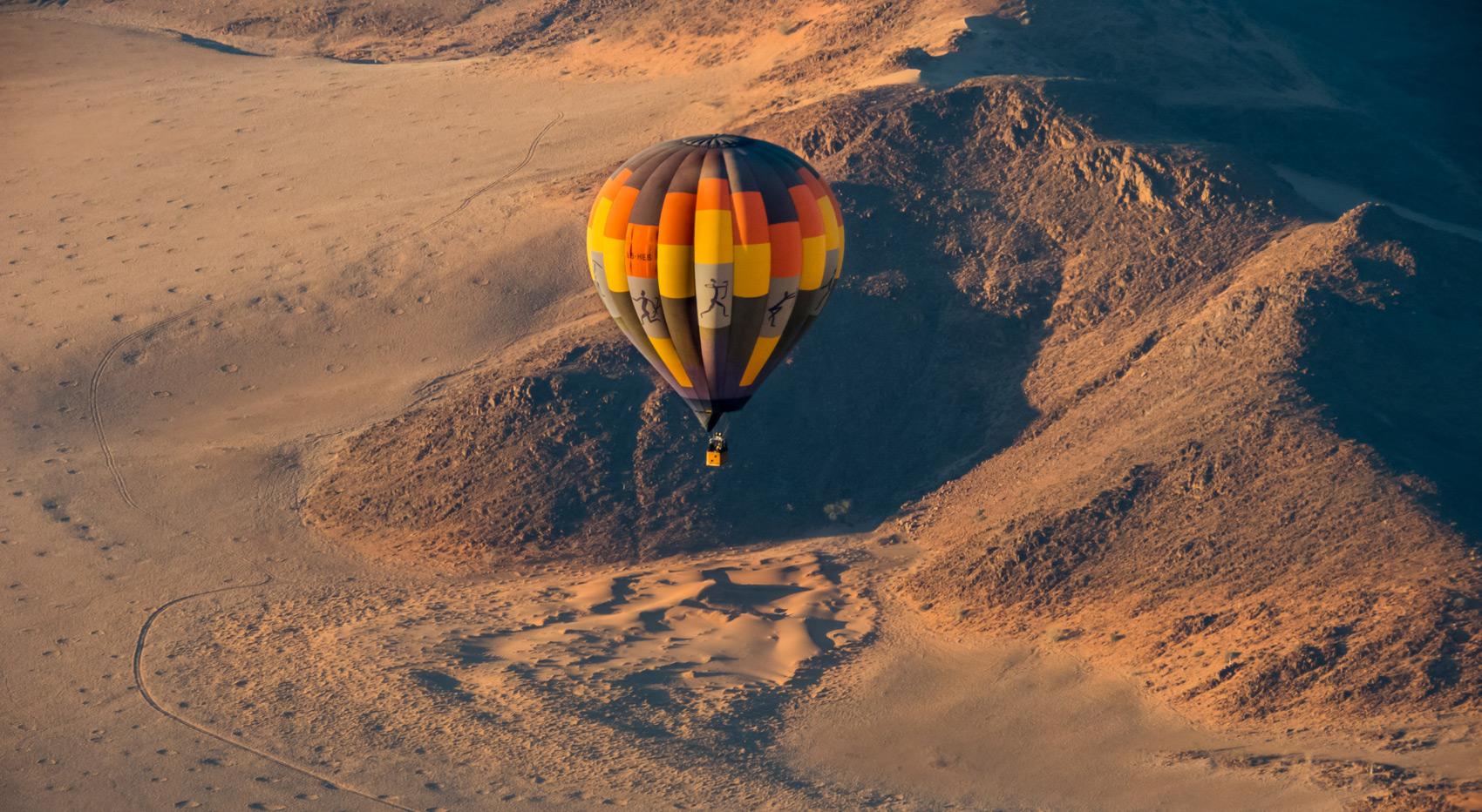 A hot air balloon above the Fairy Circles in Namibia.