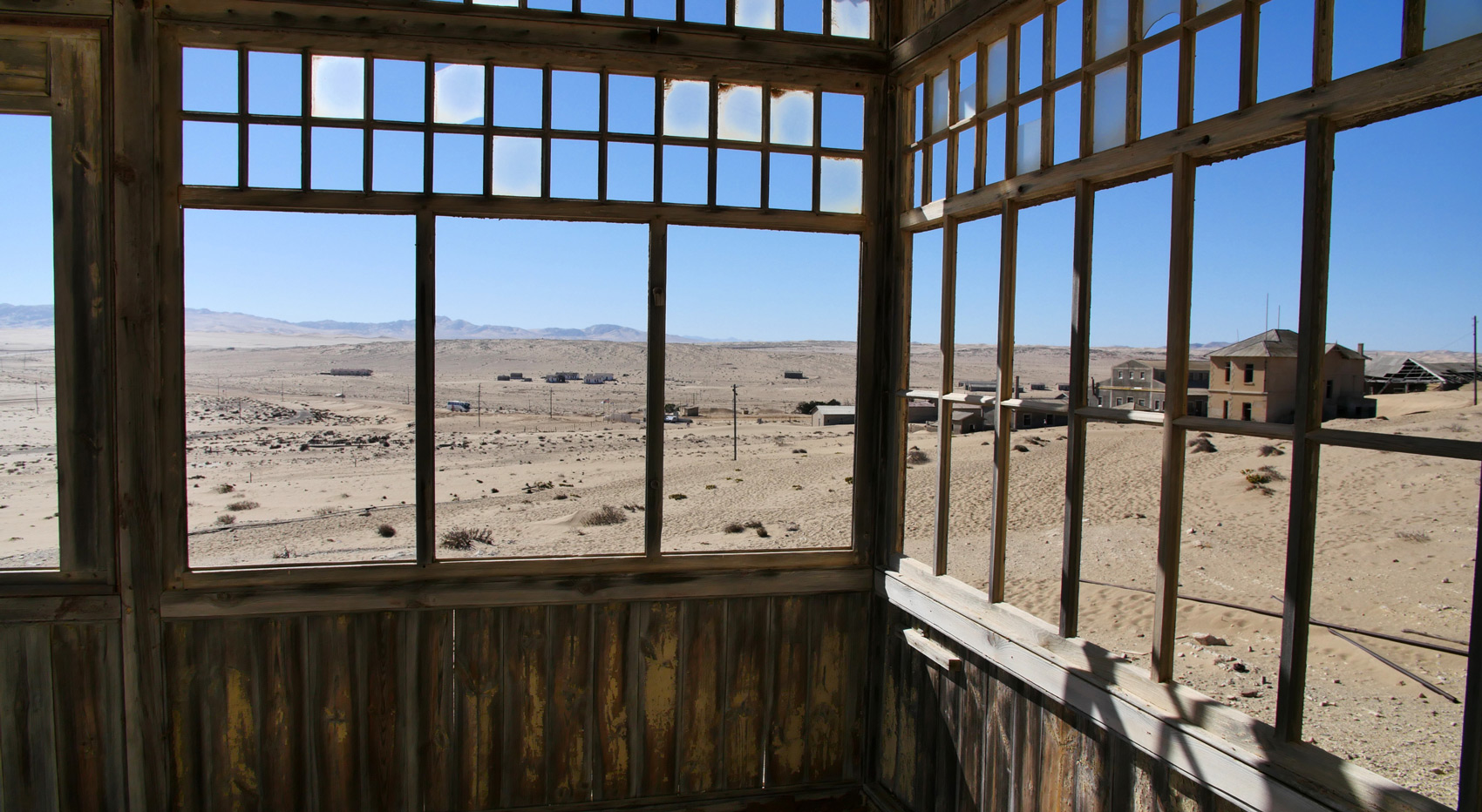 Photograph taken through a window of an abandoned house in Sperrgebiet, Namibia.
