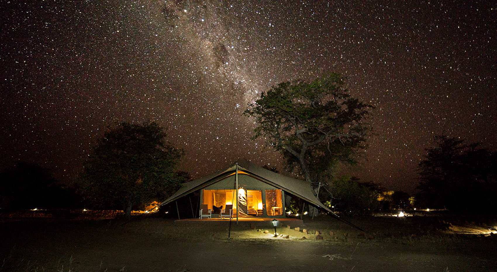 Image of one of the guests tents at Malansrus Tented Camp with the starlit sky in the background.