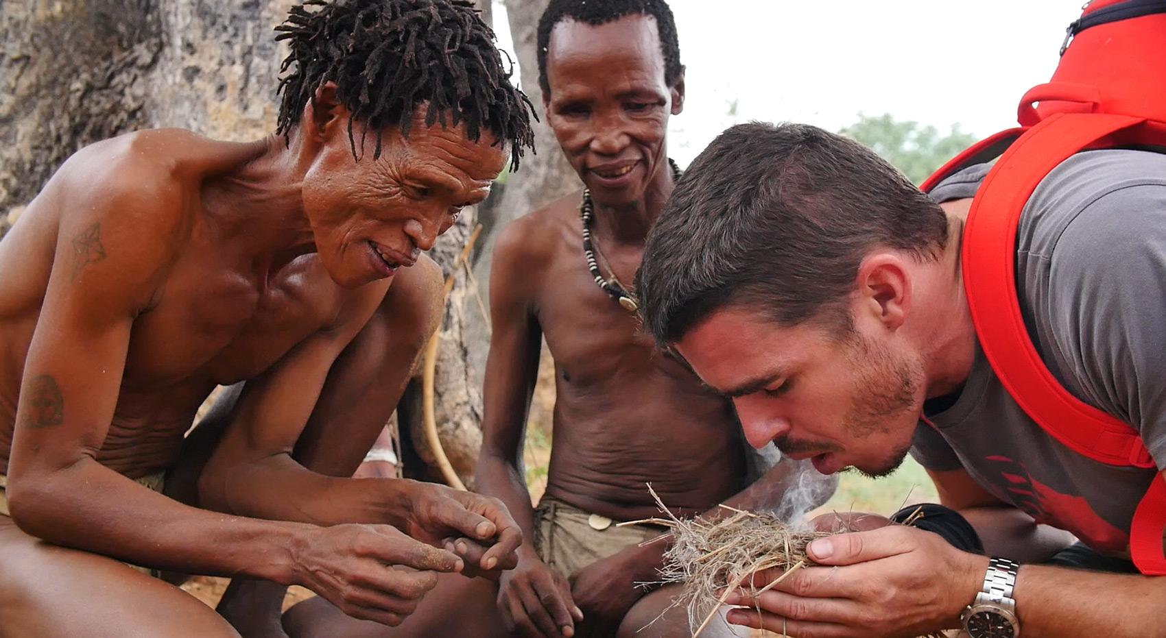 A guest attempting to make fire in the San Living Museum.