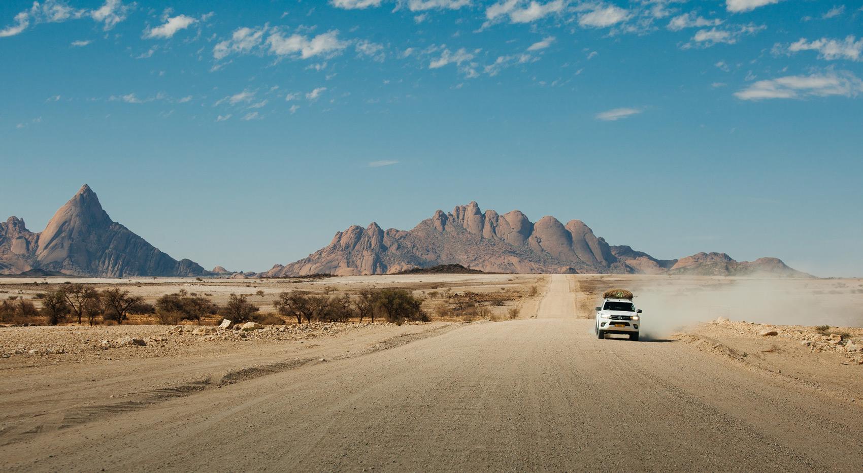 A self-drive-vehicle on a dirt road in Namibia.