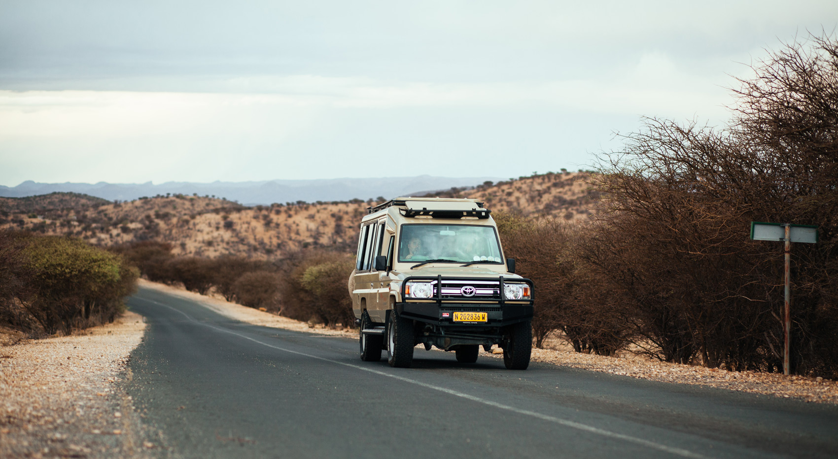 Photo of a Namibia-Experience vehicle on a road in Namibia.