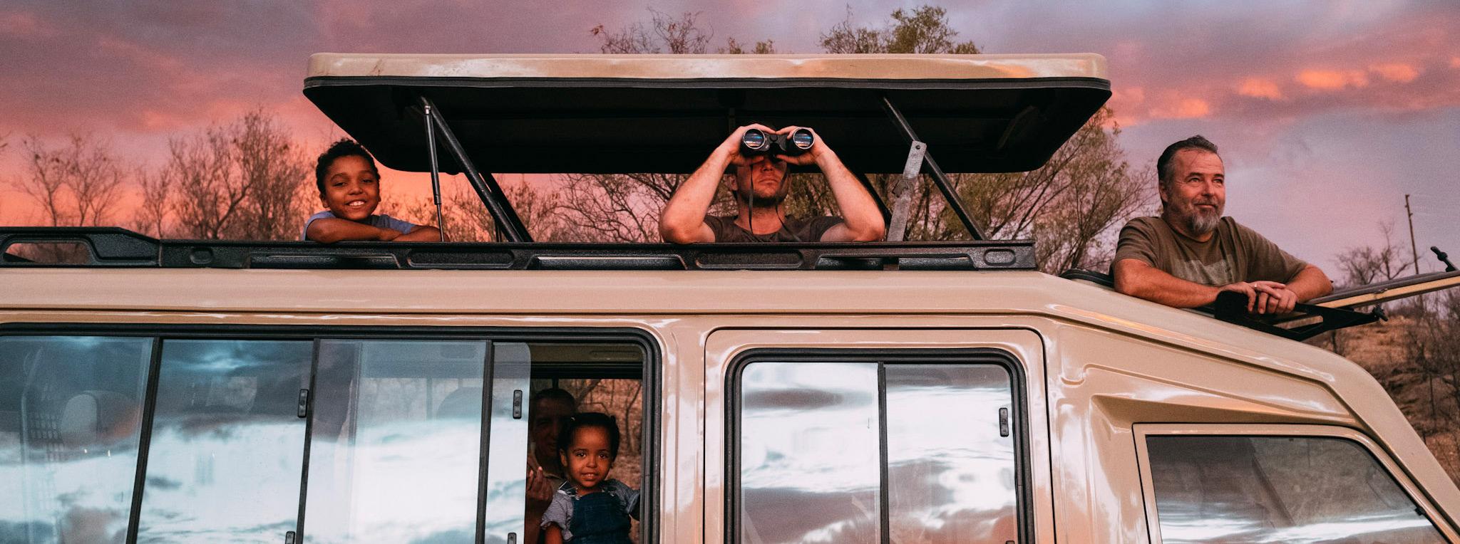 Family looking out of a game viewer.
