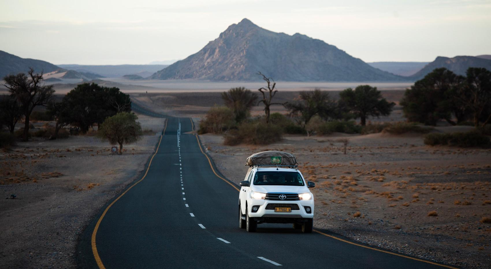 A picture of a self drive vehicle on a road close to Sossusvlei in Namibia.