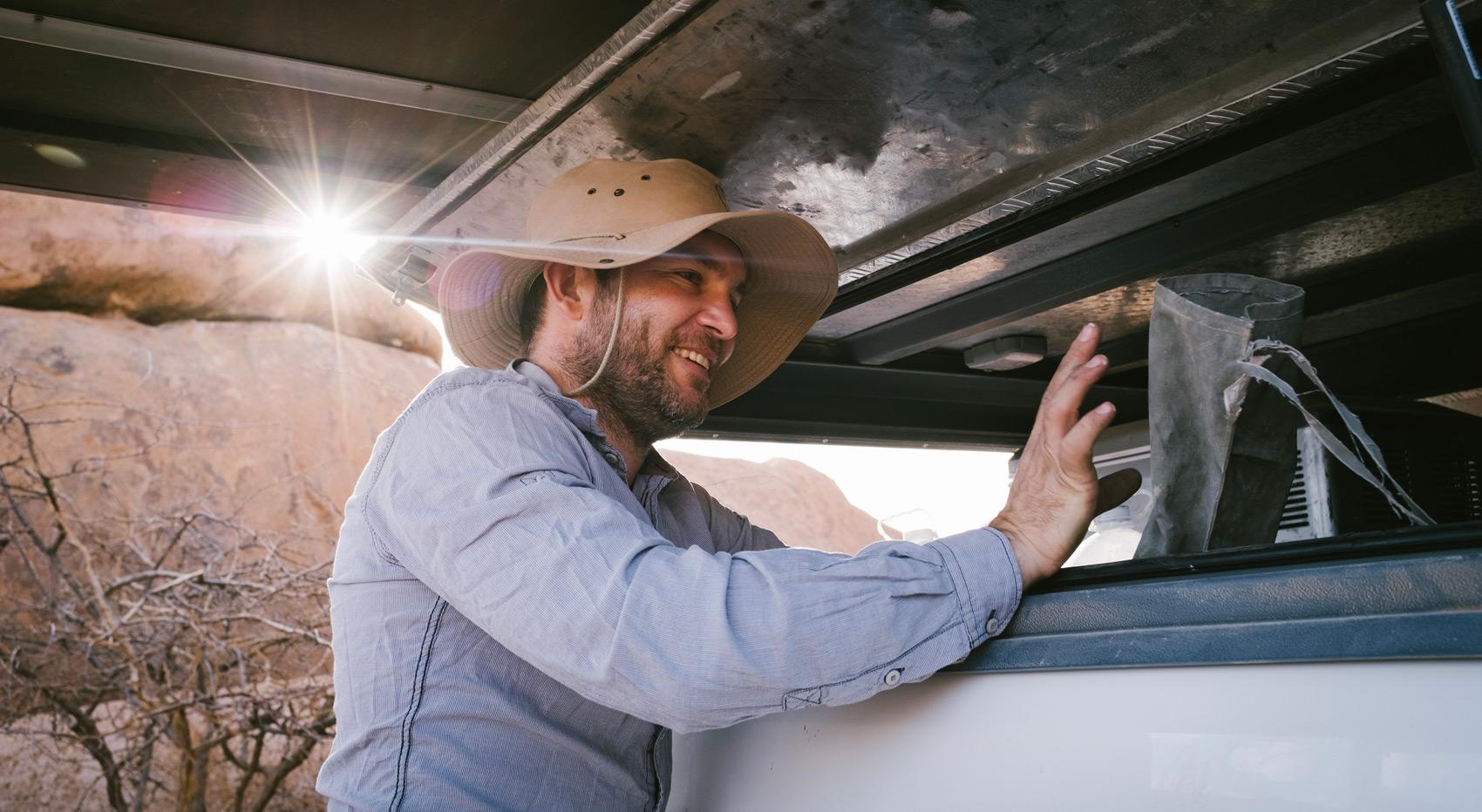 A guest getting things out of his self drive vehicle in Spitzkoppe.
