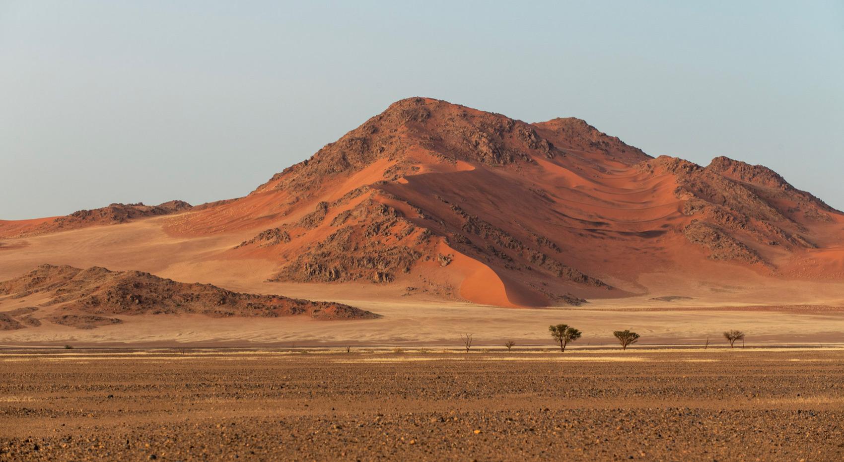 A landscape photograph of Sossusvei in the Namib desert. A landscape photograph of Sossusvei in the Namib desert.