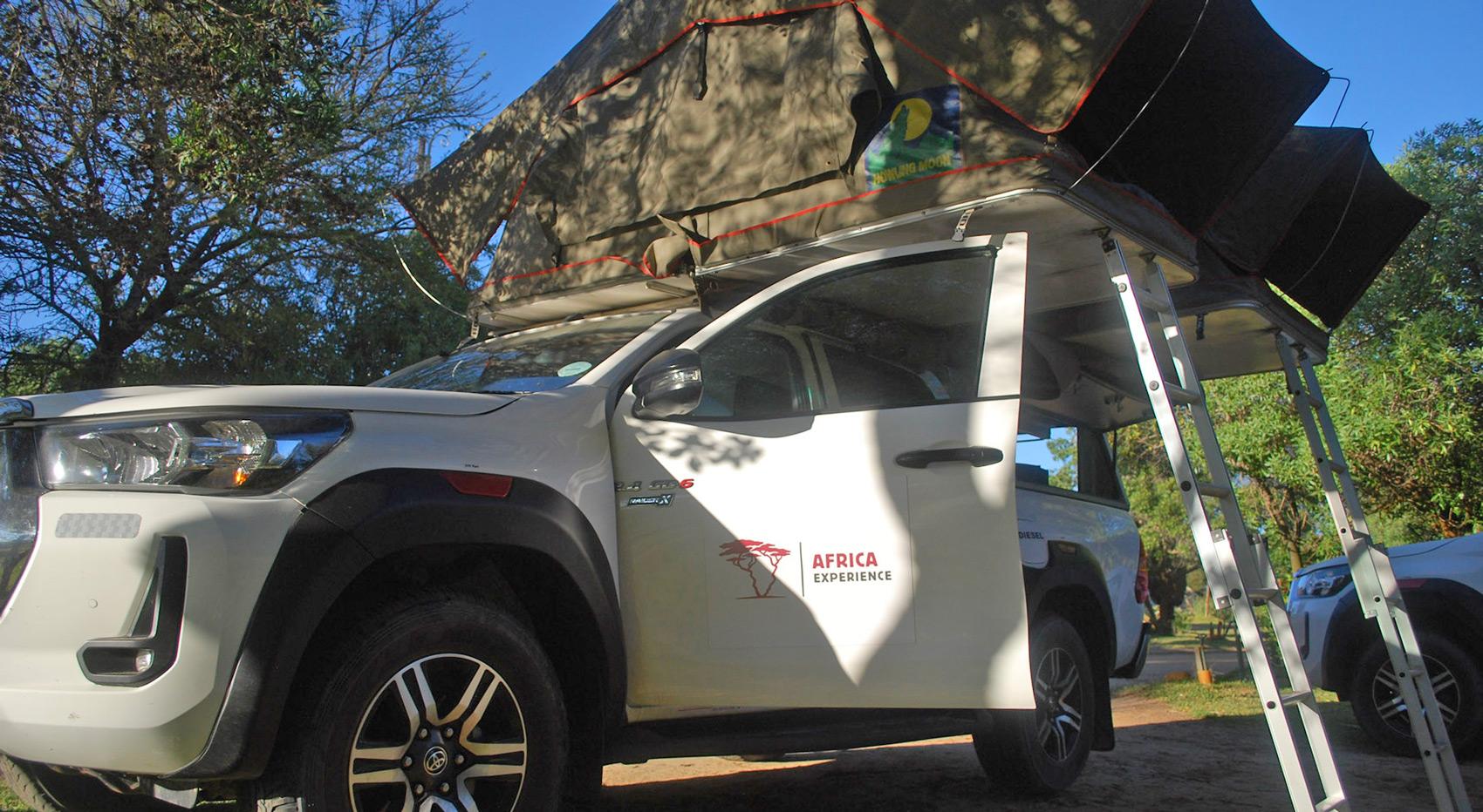 A guided-self-drive vehicle set up at a camp site. A guided-self-drive vehicle set up at a camp site.